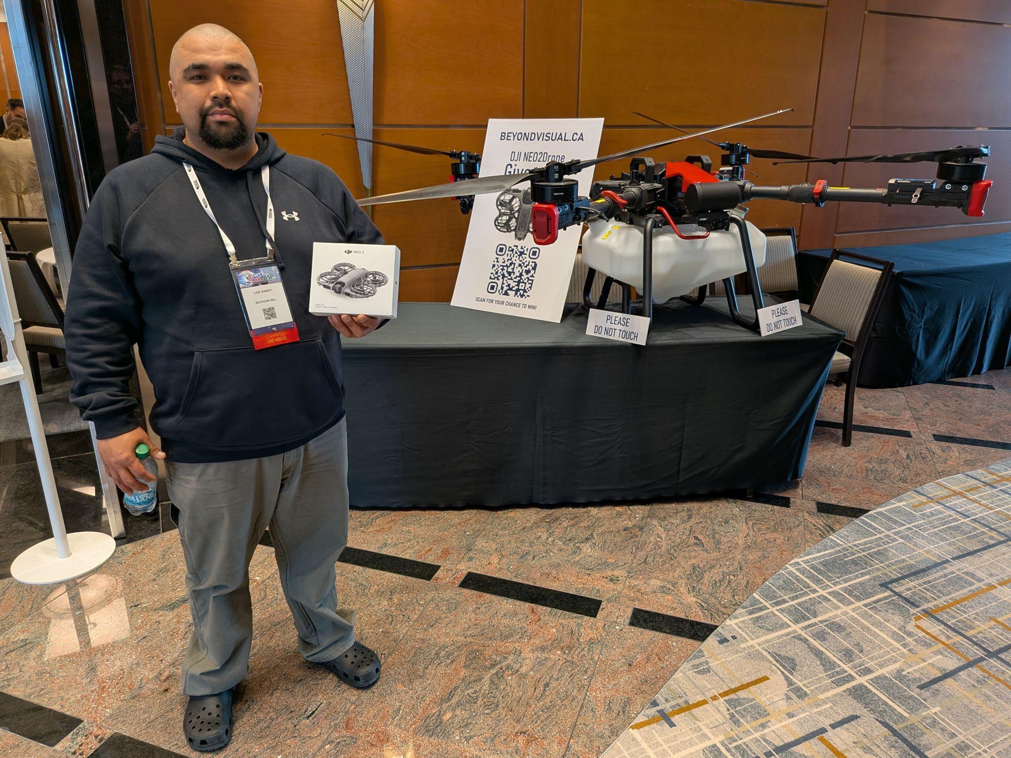 Lee Sandy, winner of the Beyond Visual DJI Neo drone draw, at the CanWISP Meeting, April 2026.